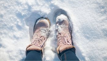 Boots standing in the snow | Experienced Idaho Podiatrist