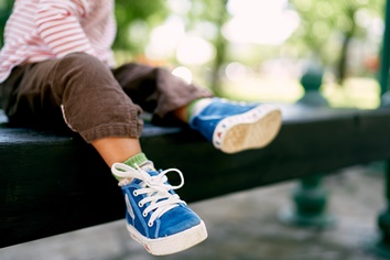 Toddler Sitting on a Park Bench | Experienced Idaho Podiatrist