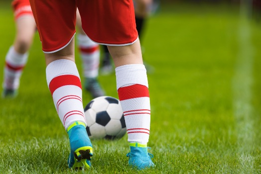Close-up-of-active-kid-on-soccer-field