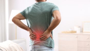Man with back pain caused by feet | Experienced Idaho Podiatrist