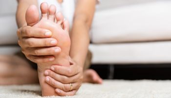 Person examining their foot | Experienced Idaho Podiatrist