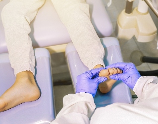 Podiatrist examining child's foot for growth plate injury | Experienced Idaho Podiatrist