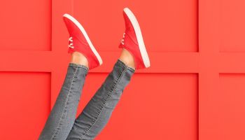 Red sneakers against red wall | Experienced Idaho Podiatrist