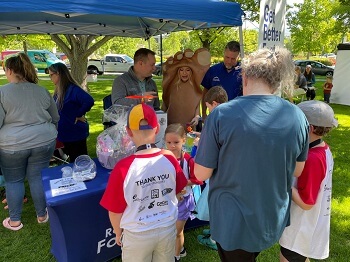 Kids and families visiting Rocky Foot & Ankle booth at Capitol Classic Kids Race 2024