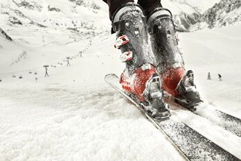 skis and ski boots on mountain slope | Experienced Idaho Podiatrist